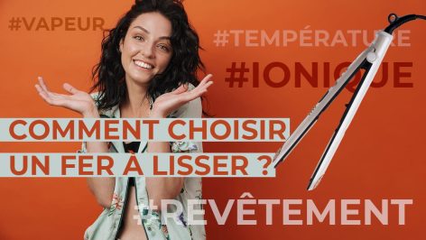 Une belle femme aux cheveux long se pose la question de quel fer à lisser choisir pour sa chevelure