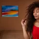 fille brune aux cheveux épais et frisés cherche meilleur lisseur pour cheveux